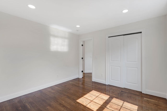 46 N Park St, Ellington, CT 06029 - unfurnished bedroom featuring baseboards, recessed lighting, wood finished floors, and a closet