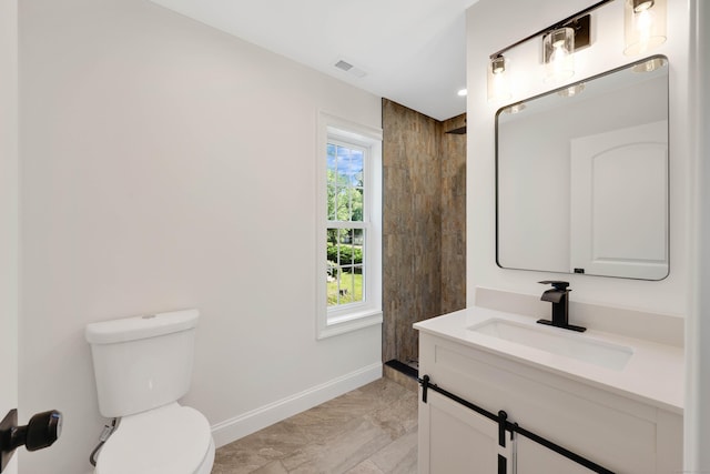 46 N Park St, Ellington, CT 06029 - bathroom with vanity, baseboards, toilet, marble finish flooring, and plenty of natural light