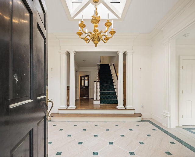130 Easton Rd, Westport, CT 06880 - tiled entryway with decorative columns, baseboards, a chandelier, crown molding, and stairway
