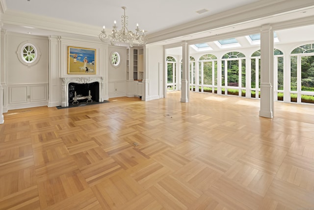 130 Easton Rd, Westport, CT 06880 - unfurnished living room with a decorative wall, decorative columns, a chandelier, a fireplace with flush hearth, and wainscoting
