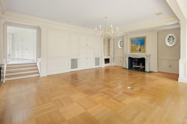 130 Easton Rd, Westport, CT 06880 - unfurnished living room featuring a decorative wall, a fireplace with flush hearth, a chandelier, decorative columns, and ornamental molding