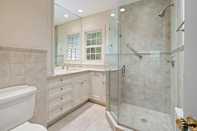 130 Easton Rd, Westport, CT 06880 - full bath with tile walls, vanity, a stall shower, toilet, and tile patterned floors