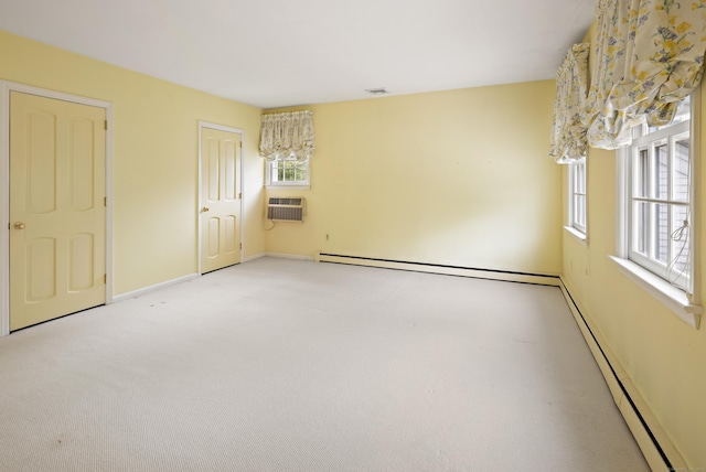 130 Easton Rd, Westport, CT 06880 - unfurnished bedroom featuring a wall unit AC, multiple windows, light colored carpet, and a baseboard heating unit
