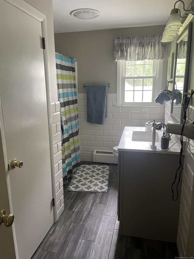 67 Geer St, Cromwell, CT 06416 - bathroom featuring baseboard heating, vanity, toilet, wood finished floors, and a shower with shower curtain