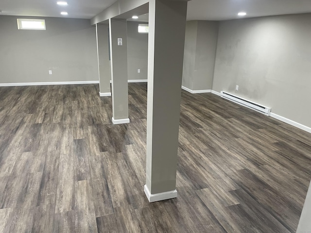 67 Geer St, Cromwell, CT 06416 - basement with a baseboard heating unit, dark wood finished floors, baseboards, and recessed lighting