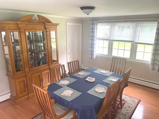 67 Geer St, Cromwell, CT 06416 - dining room featuring light wood-style floors, ornamental molding, and a baseboard radiator
