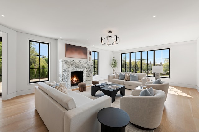 7 Dairy Rd, Greenwich, CT 06830 - living room featuring light wood-type flooring, recessed lighting, a high end fireplace, and baseboards