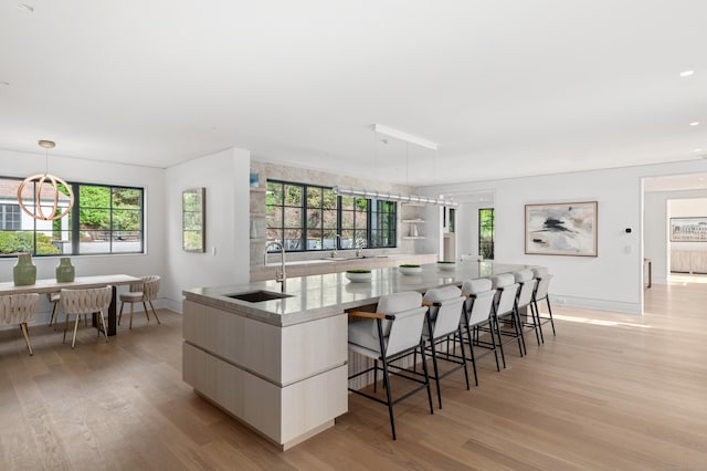 7 Dairy Rd, Greenwich, CT 06830 - kitchen with modern cabinets, a sink, light wood finished floors, baseboards, and recessed lighting