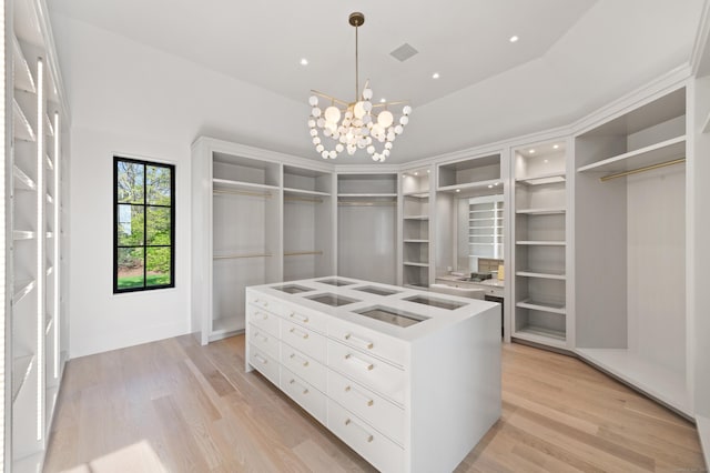 7 Dairy Rd, Greenwich, CT 06830 - walk in closet with light wood finished floors and a chandelier