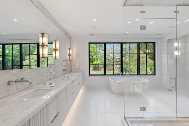 7 Dairy Rd, Greenwich, CT 06830 - full bathroom featuring tile patterned floors, a soaking tub, double vanity, a stall shower, and baseboards