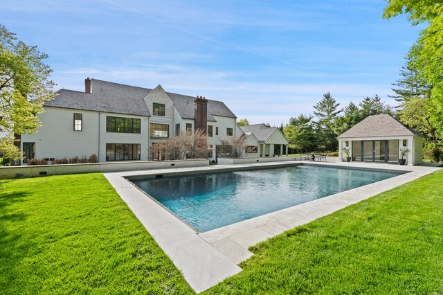 7 Dairy Rd, Greenwich, CT 06830 - swimming pool featuring a storage structure, an outdoor structure, a lawn, and a patio area