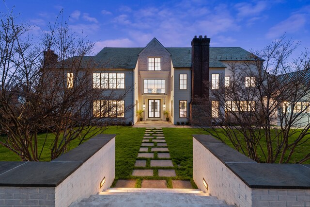 7 Dairy Rd, Greenwich, CT 06830 - view of front facade featuring a chimney, a front yard, and french doors