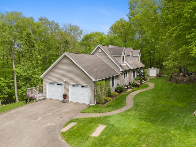 21 Dilaj Dr, Columbia, CT 06237 - view of front of house featuring driveway, a garage, a front yard, and a shingled roof
