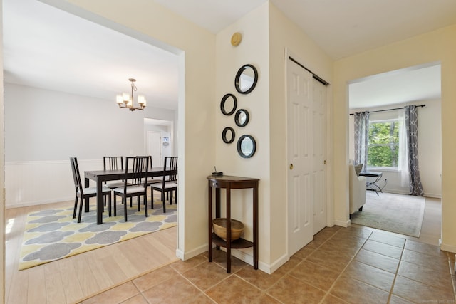 21 Dilaj Dr, Columbia, CT 06237 - hallway featuring a chandelier and light tile patterned floors