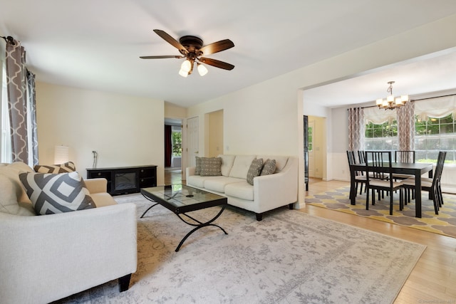 21 Dilaj Dr, Columbia, CT 06237 - living room featuring healthy amount of natural light, a chandelier, a ceiling fan, and wood finished floors