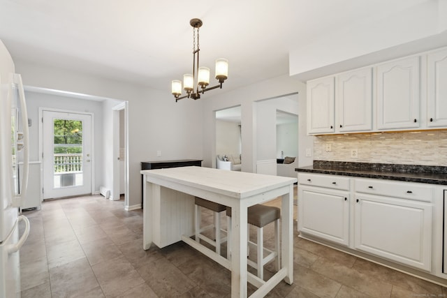 21 Dilaj Dr, Columbia, CT 06237 - kitchen with tasteful backsplash, a chandelier, white cabinets, pendant lighting, and freestanding refrigerator