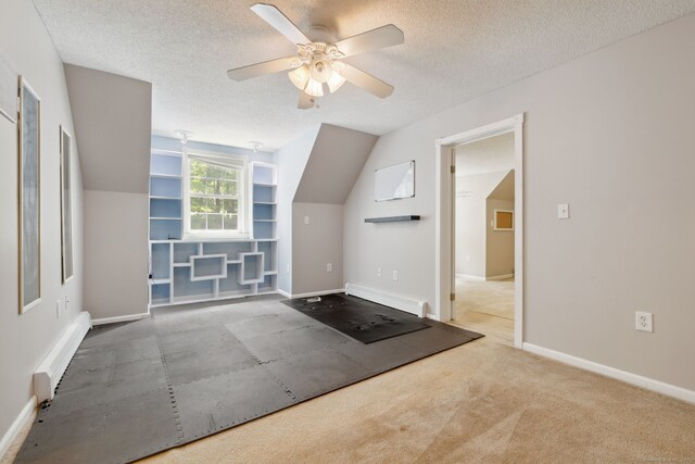 21 Dilaj Dr, Columbia, CT 06237 - bonus room with a baseboard heating unit, a ceiling fan, a textured ceiling, lofted ceiling, and baseboards