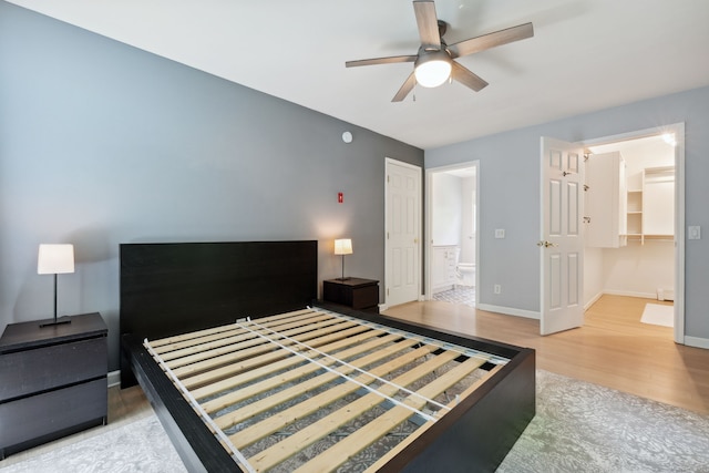 21 Dilaj Dr, Columbia, CT 06237 - unfurnished bedroom featuring wood finished floors, baseboards, connected bathroom, and ceiling fan