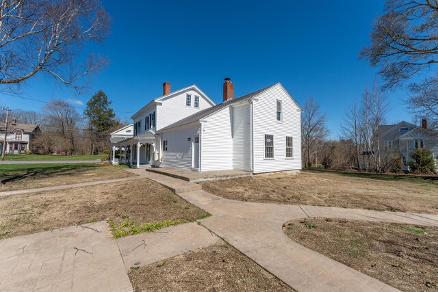 369 Thompson Rd, Thompson, CT 06277 - view of property exterior featuring a chimney and a porch