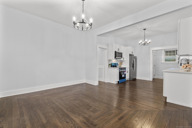 452 New Haven Ave, Derby, CT 06418 - unfurnished living room featuring a chandelier, a sink, and baseboards