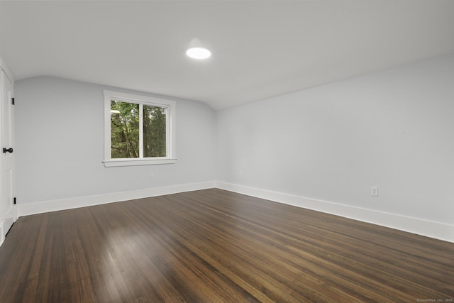 452 New Haven Ave, Derby, CT 06418 - empty room featuring lofted ceiling, dark wood-style floors, and baseboards