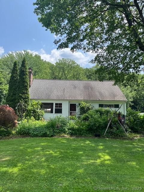 64 Hayes Rd, Simsbury, CT 06081 - single story home with a front yard and a chimney