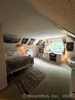 64 Hayes Rd, Simsbury, CT 06081 - carpeted bedroom featuring vaulted ceiling