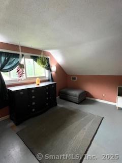 64 Hayes Rd, Simsbury, CT 06081 - bedroom with vaulted ceiling and baseboards