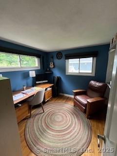 64 Hayes Rd, Simsbury, CT 06081 - home office featuring wood finished floors and healthy amount of natural light