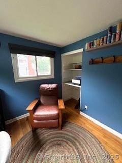 64 Hayes Rd, Simsbury, CT 06081 - sitting room with wood finished floors and baseboards