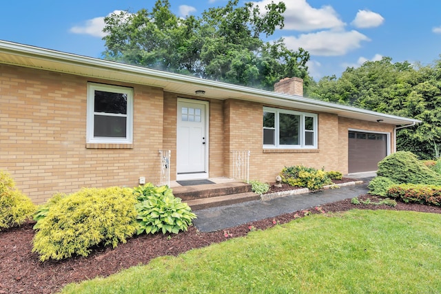 325 River Rd, Hamden, CT 06518 - ranch-style house featuring a garage, a chimney, a front lawn, and brick siding