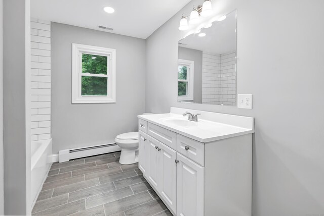 325 River Rd, Hamden, CT 06518 - bathroom featuring a baseboard radiator, vanity, toilet, wood finish floors, and recessed lighting