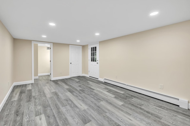 325 River Rd, Hamden, CT 06518 - unfurnished room featuring a baseboard radiator, recessed lighting, wood finished floors, and baseboards