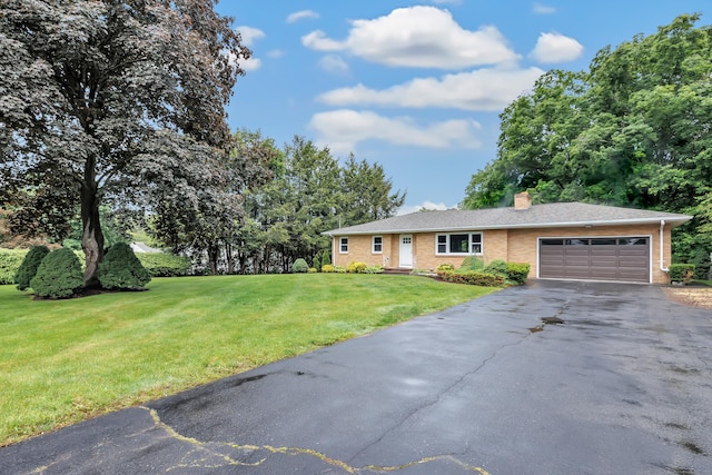 325 River Rd, Hamden, CT 06518 - ranch-style home with an attached garage, driveway, a front lawn, a chimney, and brick siding