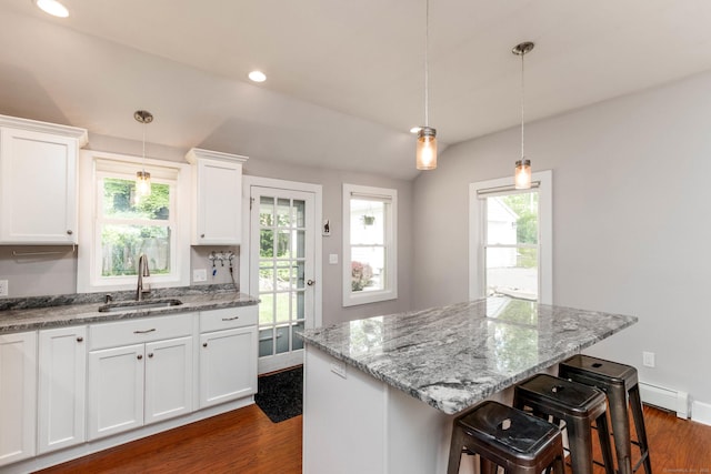 15 Seneca Rd, Middlefield, CT 06455 - kitchen with a sink, dark wood-style flooring, white cabinets, a center island, and recessed lighting
