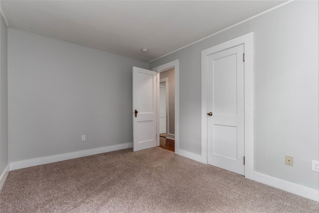 15 Seneca Rd, Middlefield, CT 06455 - unfurnished bedroom with carpet flooring, crown molding, and baseboards