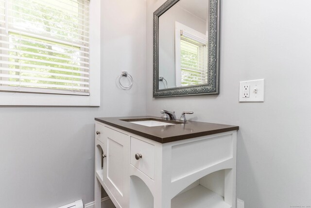 15 Seneca Rd, Middlefield, CT 06455 - bathroom featuring plenty of natural light, vanity, and a baseboard heating unit