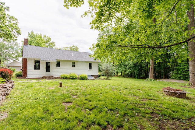 15 Seneca Rd, Middlefield, CT 06455 - view of grassy yard with a fire pit and entry steps