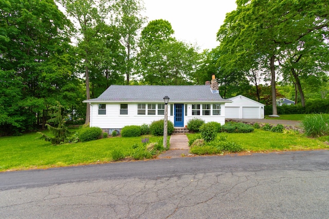 15 Seneca Rd, Middlefield, CT 06455 - view of front of property with a chimney, a front yard, a garage, and view of wooded area