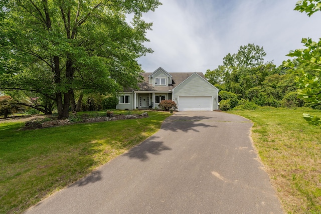 97 Spring Wood Ln, Bloomfield, CT 06002 - view of front facade featuring driveway, an attached garage, and a front yard