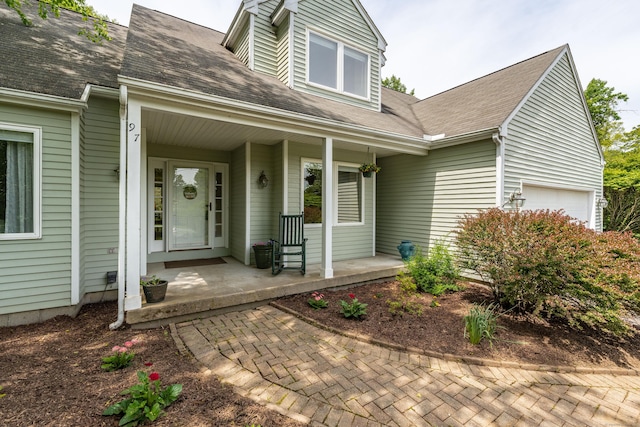97 Spring Wood Ln, Bloomfield, CT 06002 - view of front of home with a porch, an attached garage, and roof with shingles