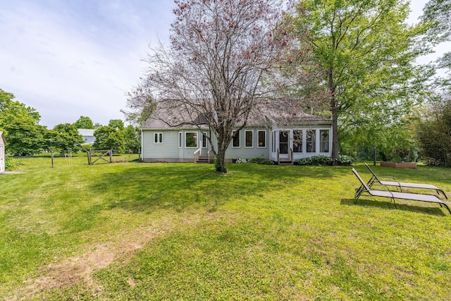 97 Spring Wood Ln, Bloomfield, CT 06002 - back of house featuring a yard, a sunroom, and entry steps