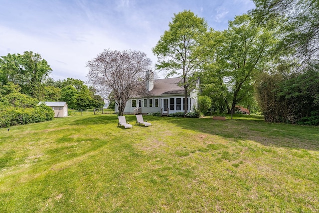 97 Spring Wood Ln, Bloomfield, CT 06002 - view of grassy yard featuring a sunroom