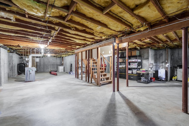97 Spring Wood Ln, Bloomfield, CT 06002 - unfinished basement featuring stairway and a water pressure tank