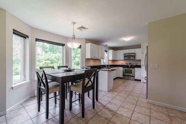 97 Spring Wood Ln, Bloomfield, CT 06002 - dining area with healthy amount of natural light and baseboards