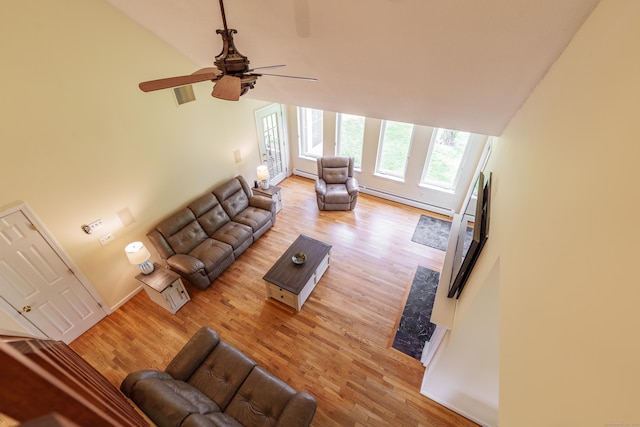 97 Spring Wood Ln, Bloomfield, CT 06002 - living area featuring a baseboard radiator, light wood-style floors, ceiling fan, and high vaulted ceiling