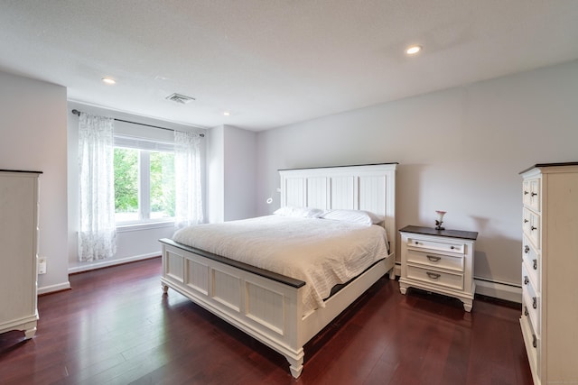 97 Spring Wood Ln, Bloomfield, CT 06002 - bedroom with a baseboard radiator, dark wood finished floors, recessed lighting, and baseboards