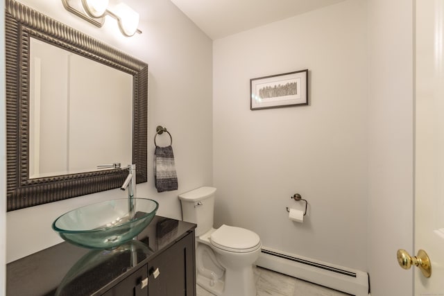 97 Spring Wood Ln, Bloomfield, CT 06002 - bathroom with a baseboard heating unit, vanity, toilet, and marble finish floors