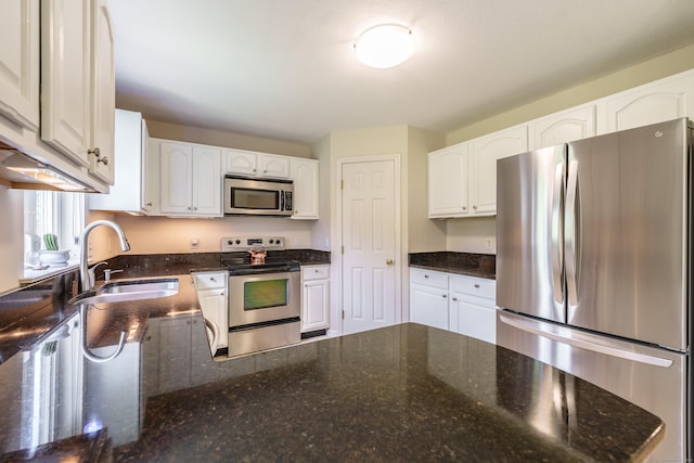 97 Spring Wood Ln, Bloomfield, CT 06002 - kitchen with stainless steel appliances, a sink, and white cabinetry