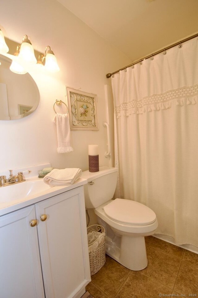 35 Mountain Village Rd Unit 15, Waterbury, CT 06706 - full bathroom featuring toilet, vanity, tile patterned flooring, and curtained shower
